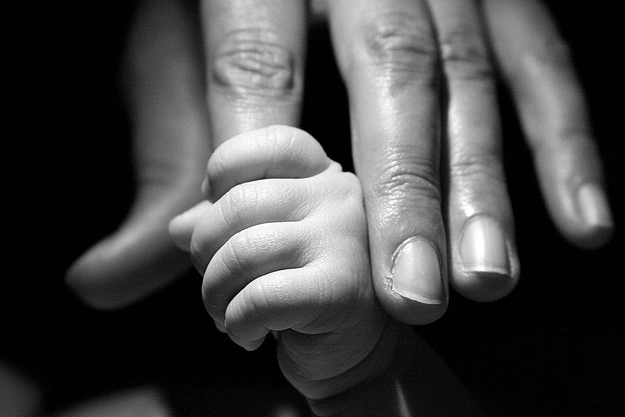 Babies fingers will automatically hold onto things they feel in their hand.