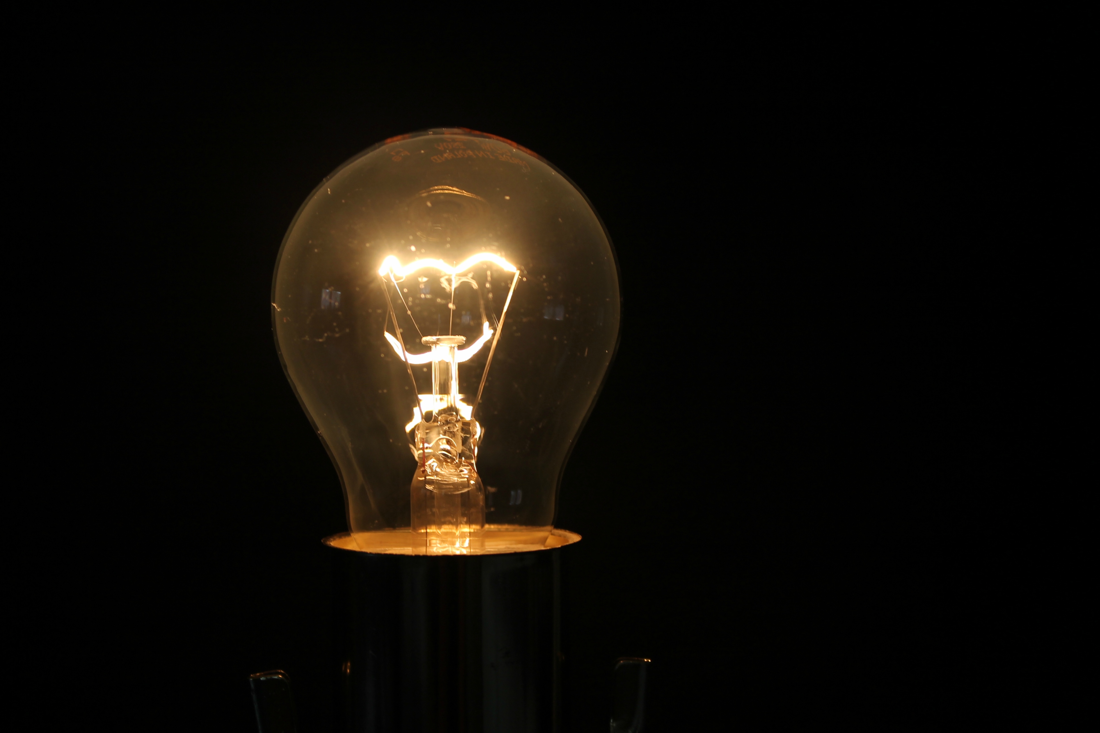 Some materials are harder for the electricity to get through than others. The 'filament' part of this bulb resists the electricity and ends up getting so hot it glows bright enough to light a room!