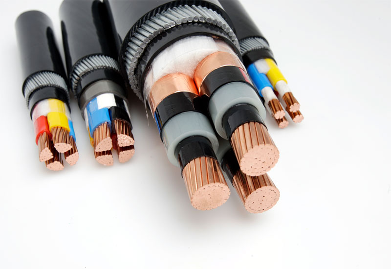 Power cables are made of metal on the inside (the wire to carry the electricity) with a plastic coating (the insulator to stop the electricity escaping).