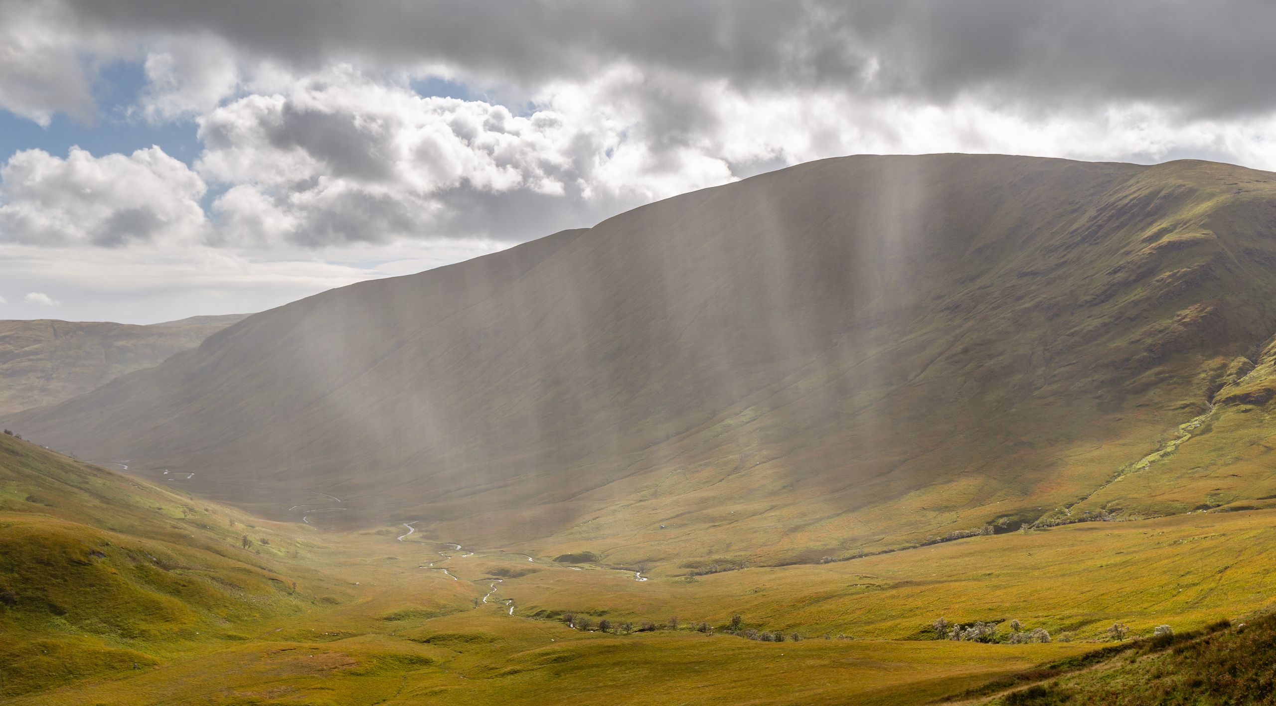 Clouds are made of tiny water droplets. When enough of them bump into each other and stick together they get big enough and heavy enough that they fall out of the cloud as rain.